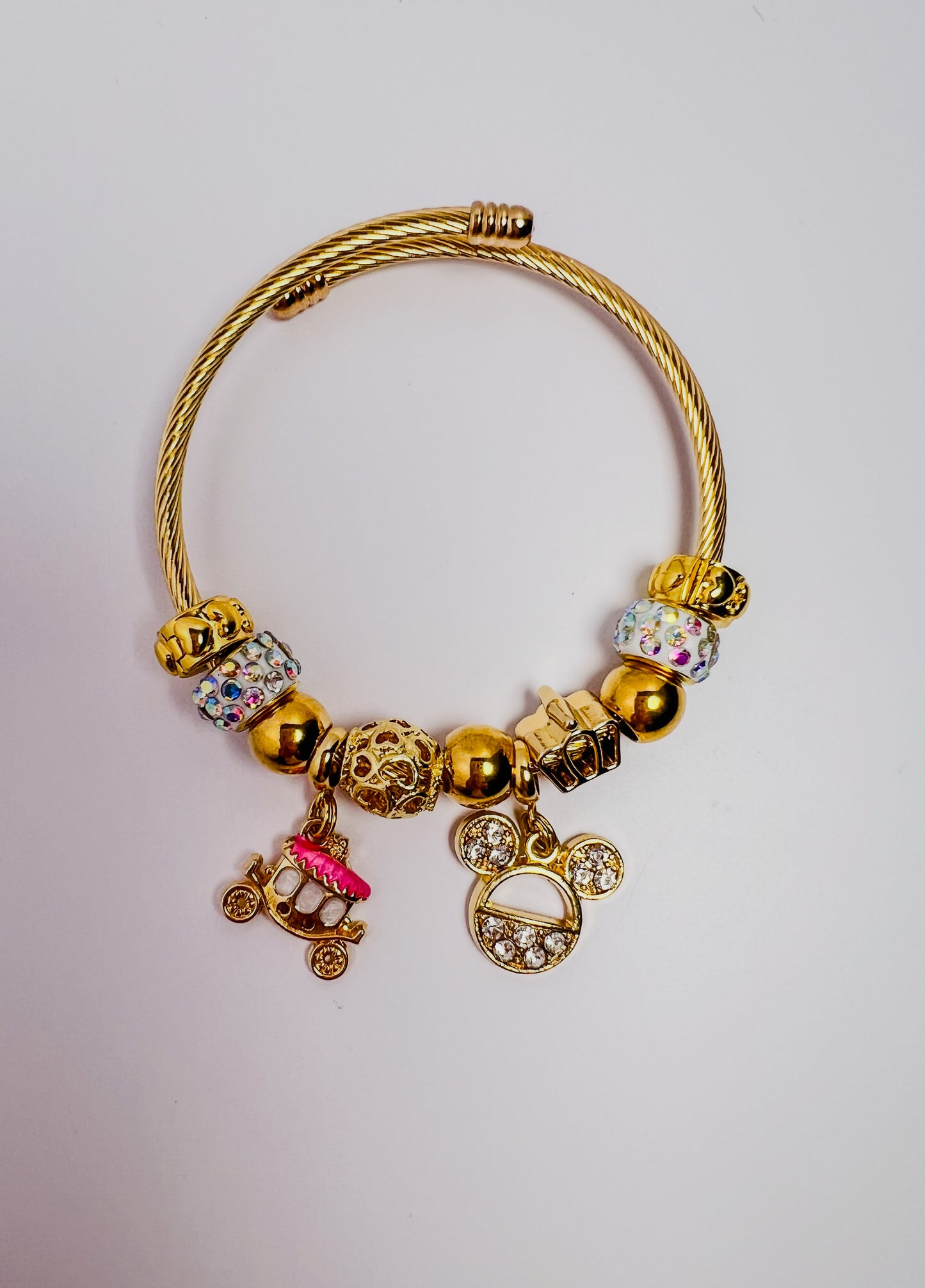 Pink carriage/mouse ear charm bracelet (gold)